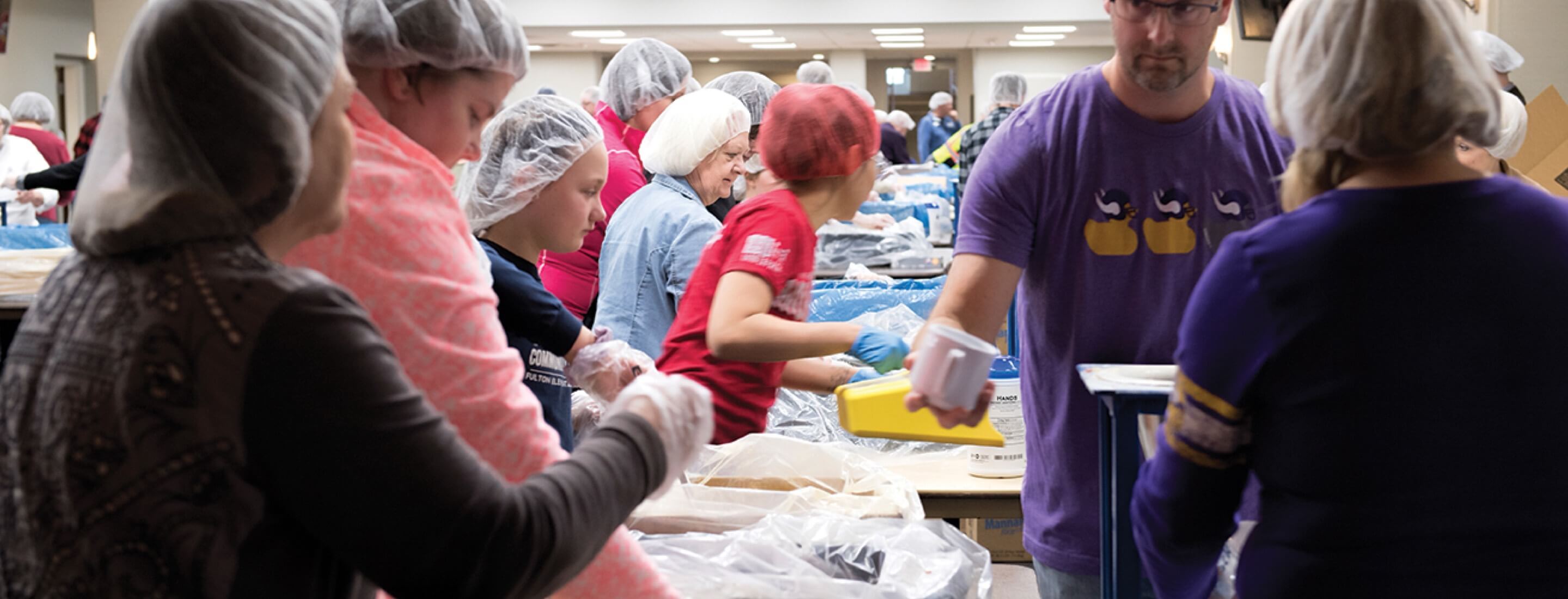 group serving while doing charity work